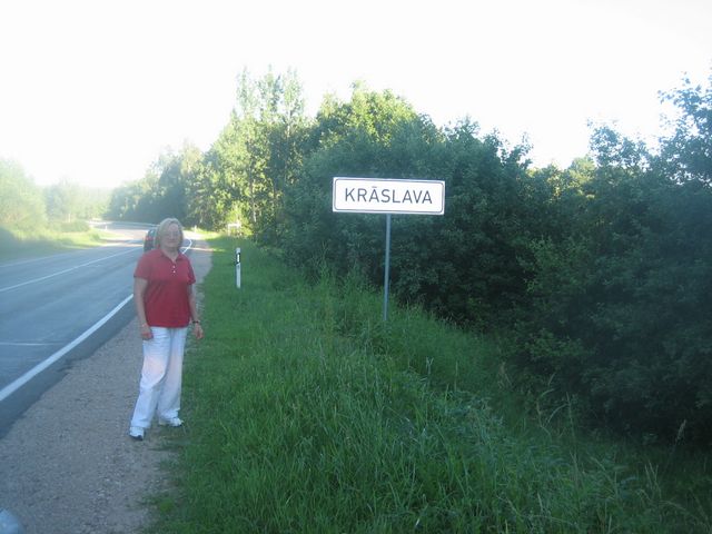 Ruth Kurtz in front of Kraslava
                sign