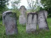 Weathered headstones in a meadow, Arbore