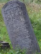 A leaning carved headstone, Arbore