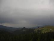 Dark clouds over forested hills, Bukovina