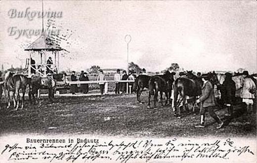 Peasants leading horses across a field near a wooden judges' stand, spectators along a rail, handwriting below