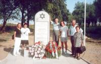The Tunkelshwartz Family standing around the Memorial Stone, Radzyn, 14.8.95.