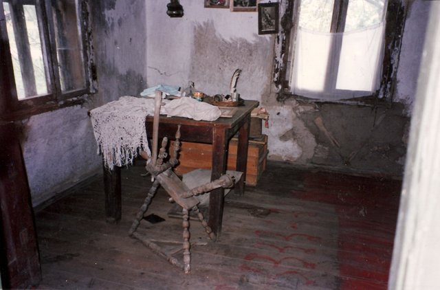 Table with old spinning wheel,
                              1996