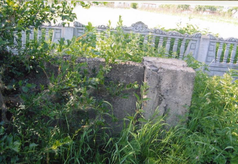 Rear: new wall surrounding cemetery; Front: part of old wall