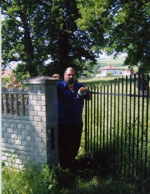 Henrik, our driver, standing at the gate to the Dubiecko Cemetery  june 2006