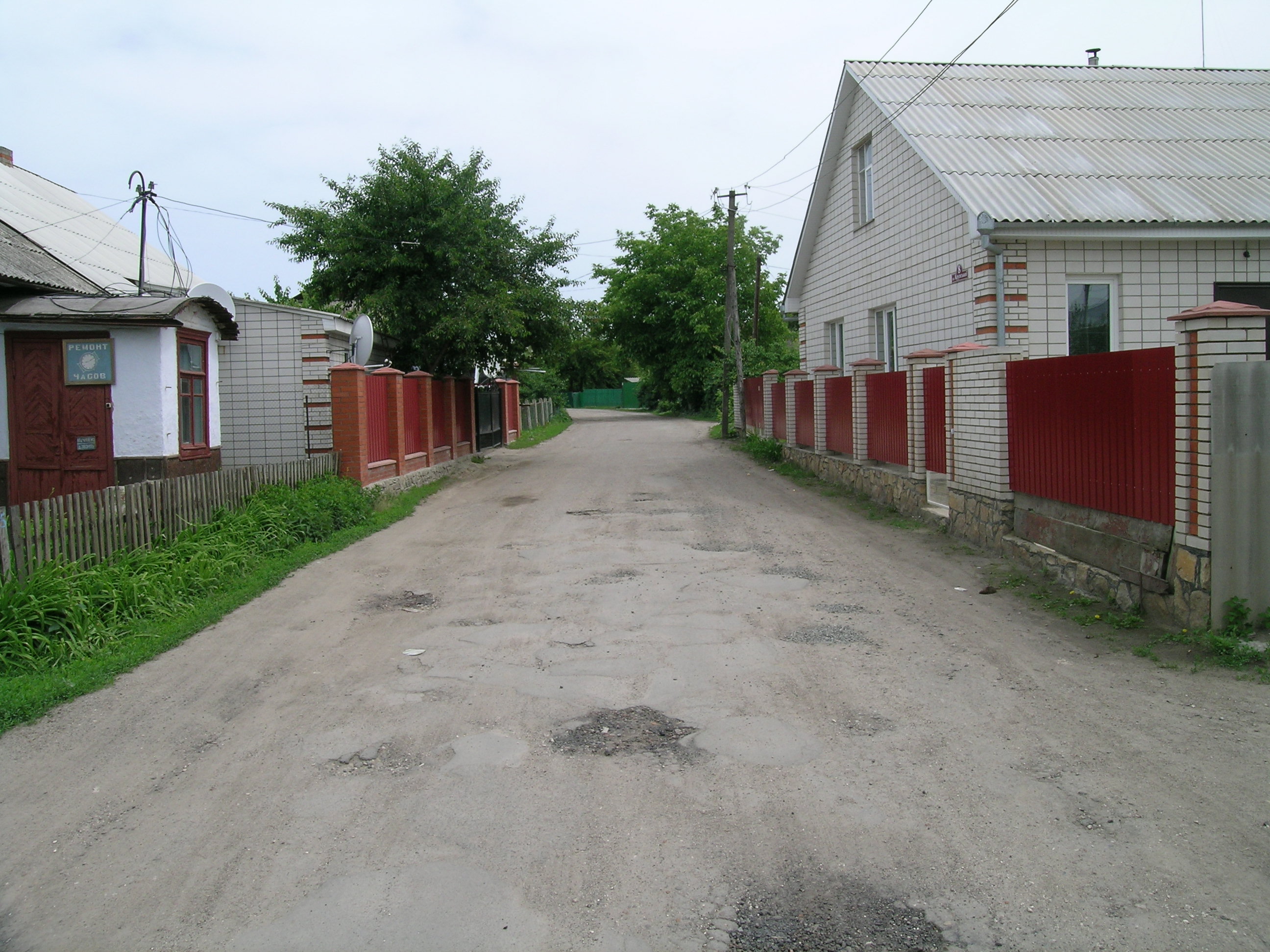 Kryzhopil; street displaying omnipresent
                          potholes
