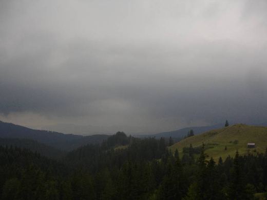 Dark clouds over forested hills, Bukovina