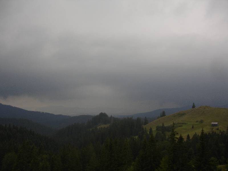 Dark clouds over forested hills, Bukovina