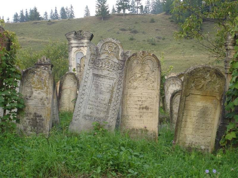 Old carved headstones on a hillside, Gura Humorului