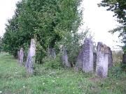 Tall weathered headstones in the Arbore cemetery