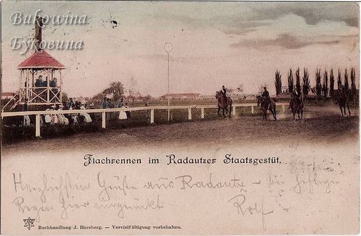 Coloured view of riders on a racecourse, spectators along a white rail and a raised wooden judges' stand